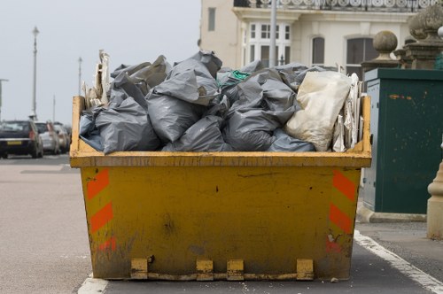 Vans loading reusable furniture during an eco-friendly house clearance in Beckenham